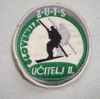 Našitek učitelj II, prejšnji vaditelj smučanja (2004).